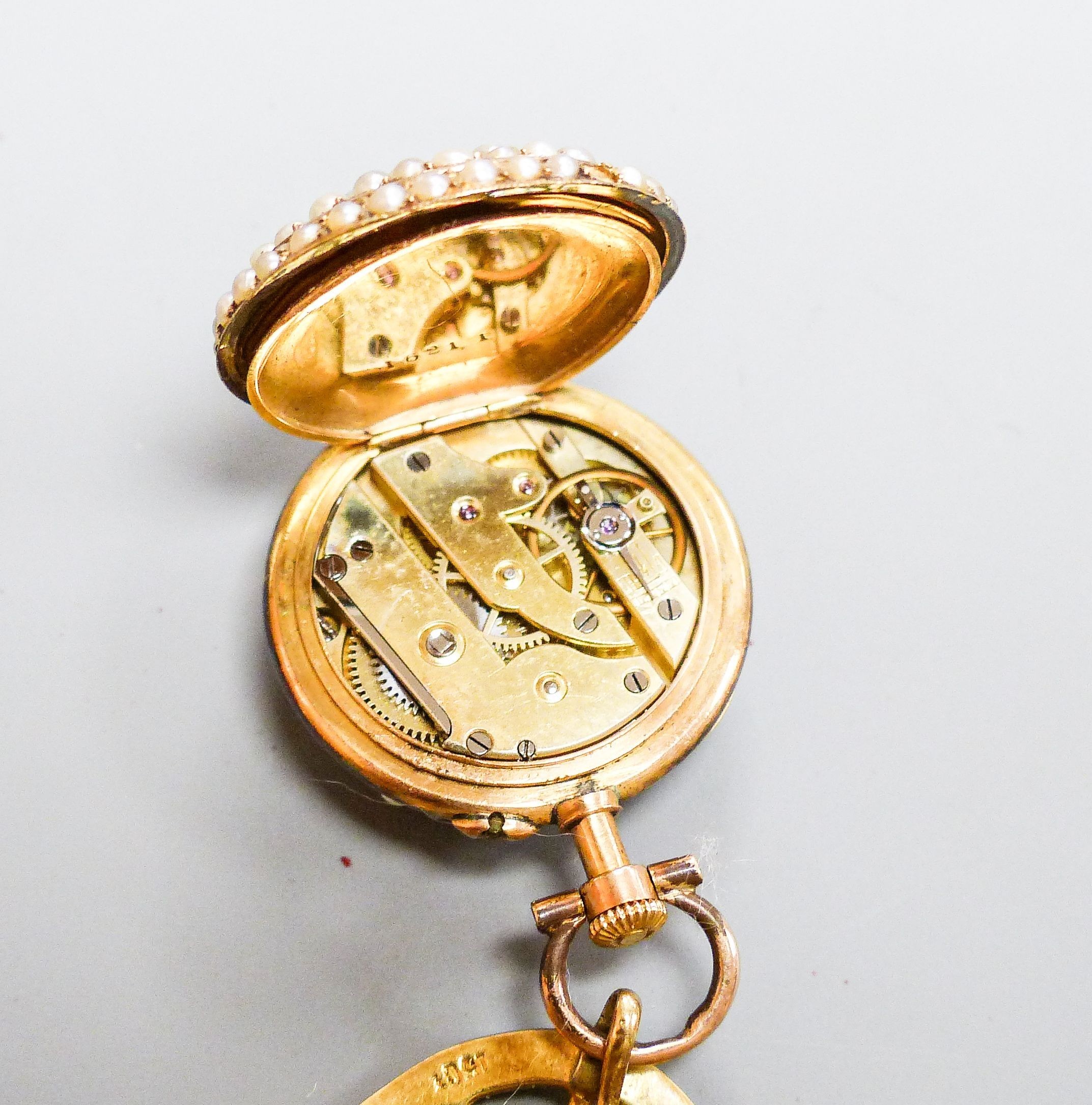 A continental yellow metal, rose cut diamond and split pearl set open face fob watch, case diameter 22mm, on an associated 15ct and seed pearl suspension brooch (a.f.)